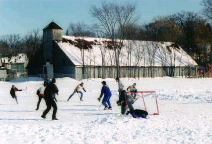 Image of boys playing hockey in front of the Stannus Street rink Stannus Street Rink, Windsor, built in 1897 following the great Windsor Fire which destroyed Windsor’s first rink built at Fort Edward in 1870. The Stannus St rink is the oldest standing wooden rink in Canada.